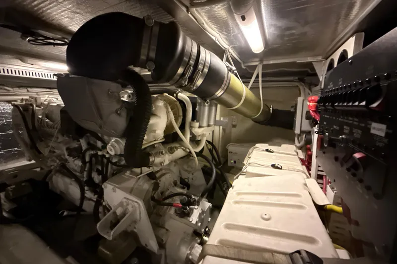Orion Yacht Photos Pics Engine room of a 2004 Carver 460 Voyager yacht, showcasing mechanical components and systems.