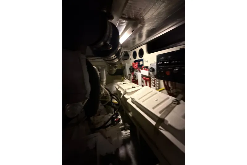 Orion Yacht Photos Pics Engine room of 2004 Carver 460 Voyager yacht, featuring mechanical components and control panels.