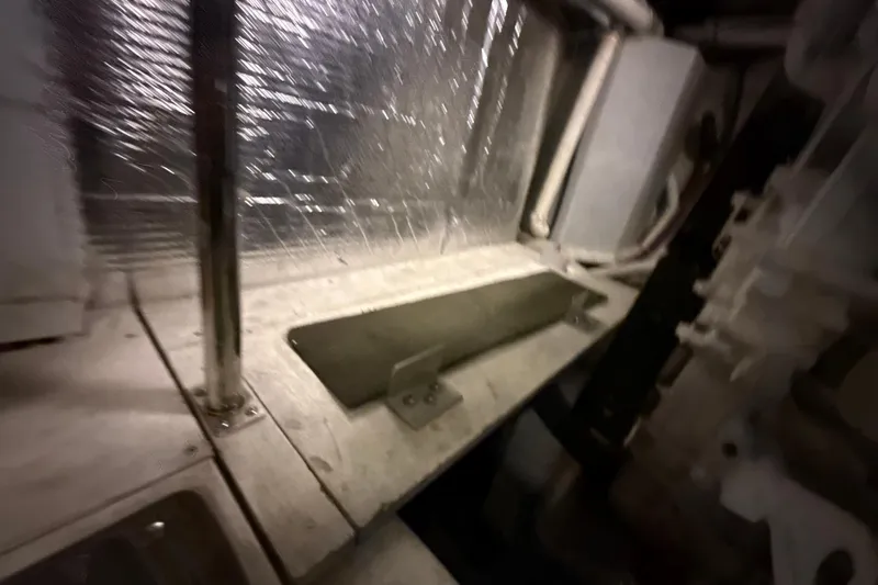 Orion Yacht Photos Pics Engine room of a 2004 Carver 460 Voyager yacht, featuring metallic components.