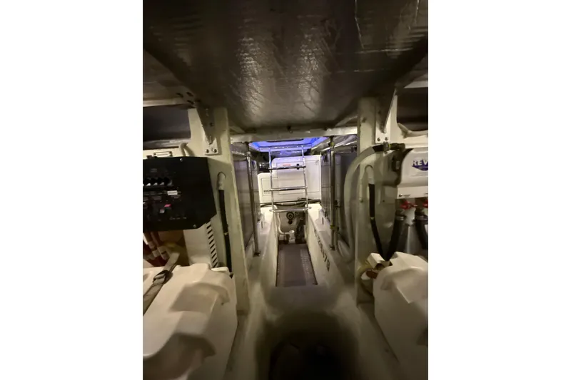 Orion Yacht Photos Pics Engine room of 2004 Carver 460 Voyager yacht, showcasing mechanical components and equipment.