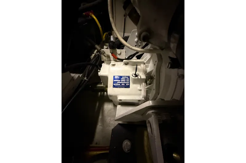 Orion Yacht Photos Pics Engine compartment of a 2004 Carver 460 Voyager yacht, showcasing mechanical components.