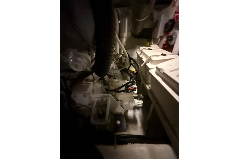 Orion Yacht Photos Pics Engine room of a 2004 Carver 460 Voyager yacht, showcasing mechanical components.