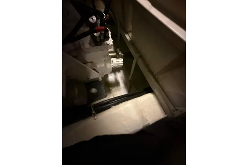 Orion Yacht Photos Pics Engine compartment of a 2004 Carver 460 Voyager yacht, showcasing mechanical components.