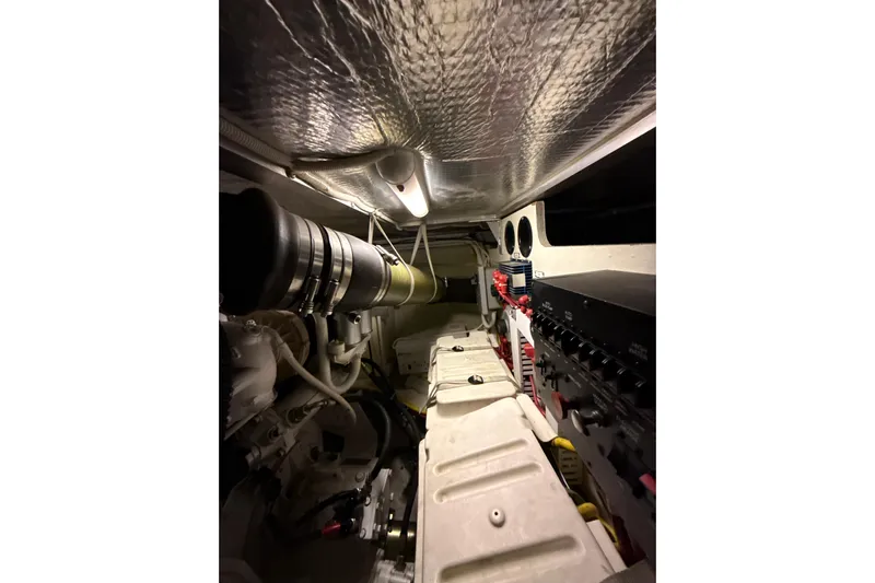 Orion Yacht Photos Pics Engine room of 2004 Carver 460 Voyager yacht, showcasing mechanical components and wiring.