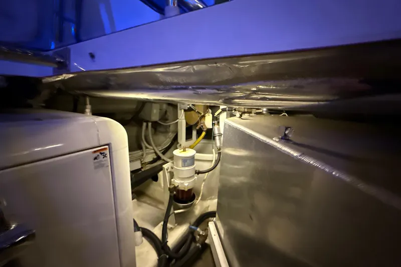 Orion Yacht Photos Pics Engine room of a 2004 Carver 460 Voyager yacht, showcasing mechanical components and wiring.