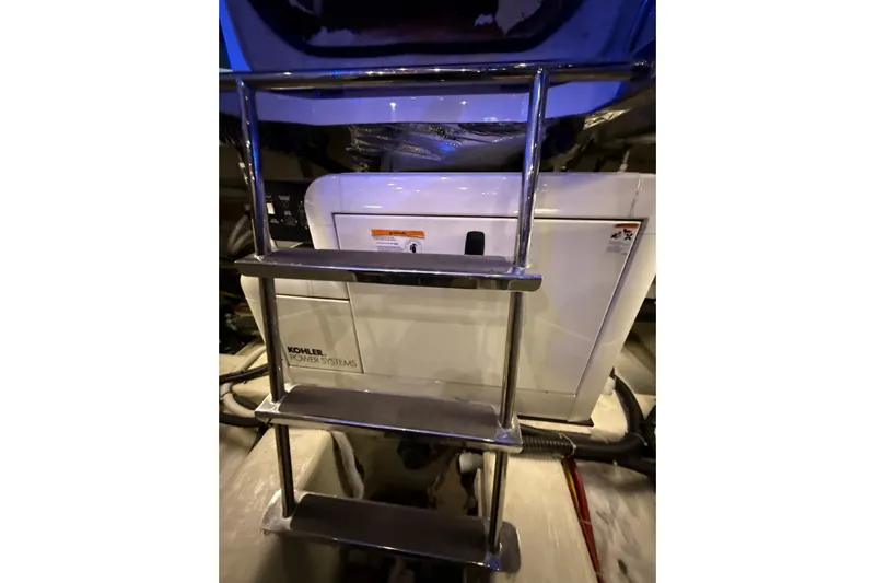 Orion Yacht Photos Pics Engine room of 2004 Carver 460 Voyager with Kohler power system and metal ladder.