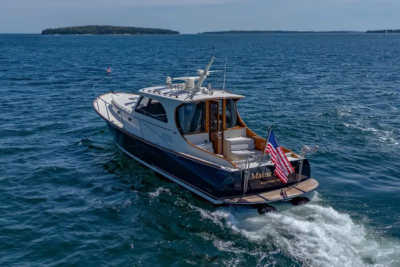 Maine Squeeze Yacht Photos Pics 2009 Hinckley Talaria 44 MY yacht cruising on open water.