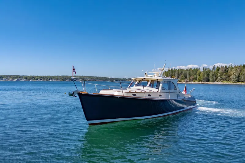 Maine Squeeze Yacht Photos Pics 2009 Hinckley Talaria 44 MY yacht cruising on a clear blue lake.