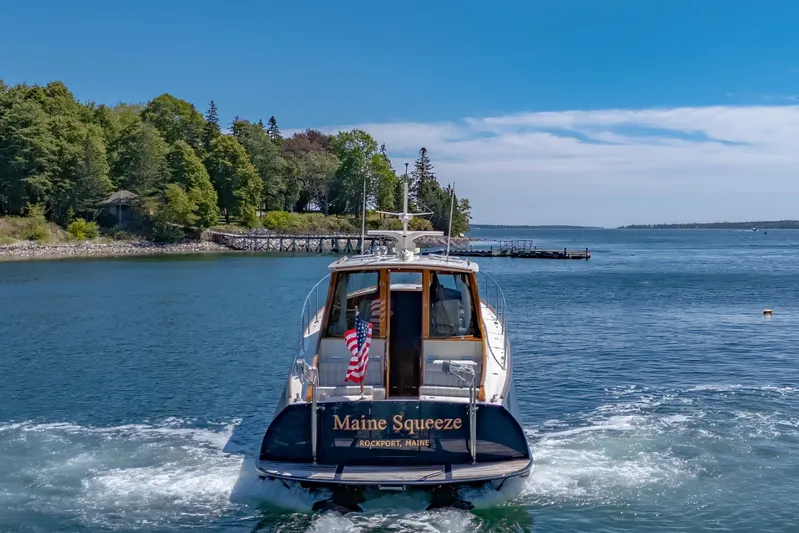 Maine Squeeze Yacht Photos Pics 2009 Hinckley Talaria 44 MY yacht cruising in scenic coastal waters.