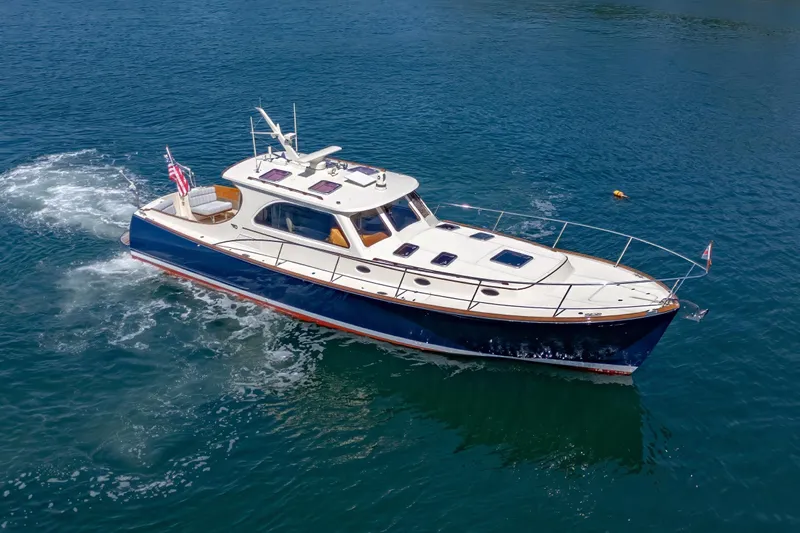 Maine Squeeze Yacht Photos Pics 2009 Hinckley Talaria 44 MY yacht cruising on clear blue water.