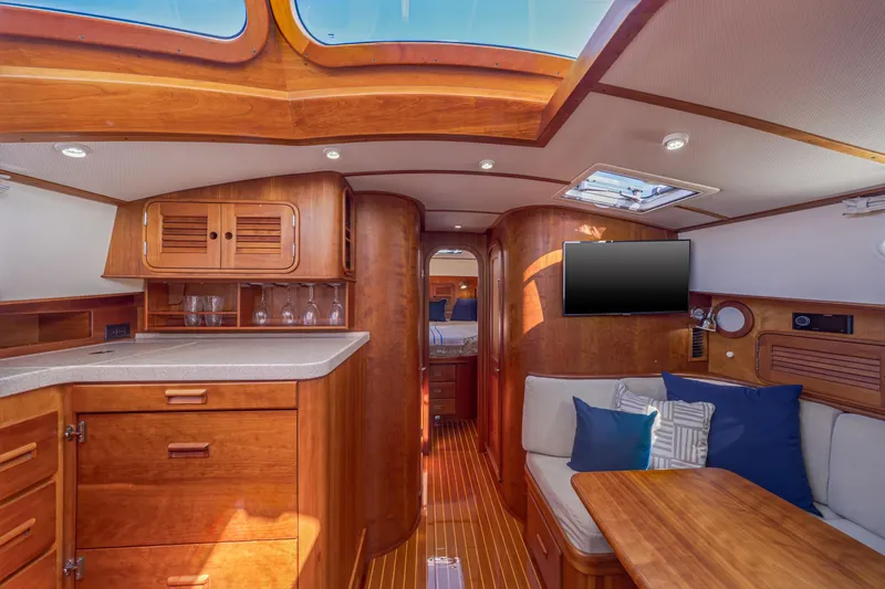 Maine Squeeze Yacht Photos Pics Luxurious interior of 2009 Hinckley Talaria 44 MY yacht with wood finishes and modern amenities.