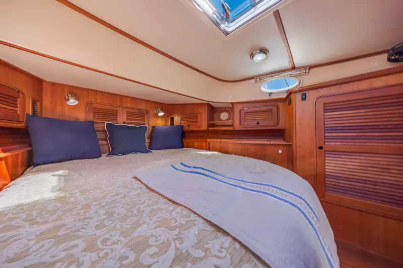 Maine Squeeze Yacht Photos Pics Luxurious cabin interior of 2009 Hinckley Talaria 44 MY yacht with elegant wood finish.