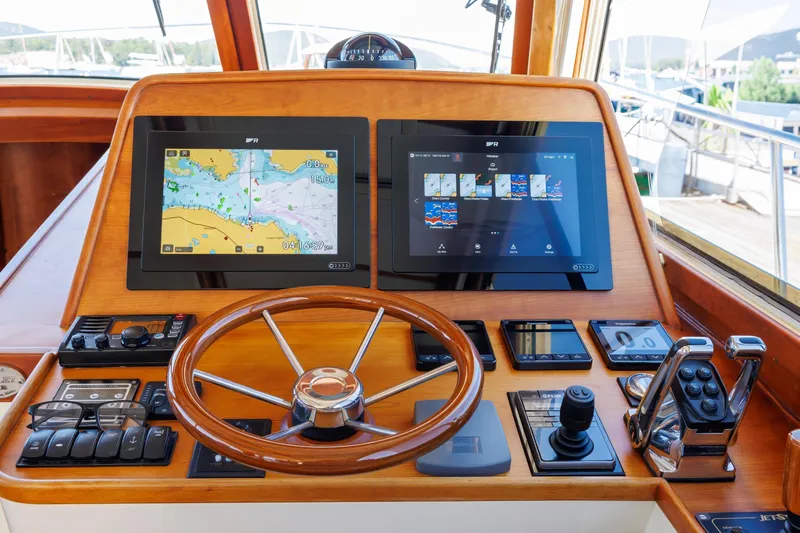 Maine Squeeze Yacht Photos Pics Helm of 2009 Hinckley Talaria 44 MY with navigation screens and controls.
