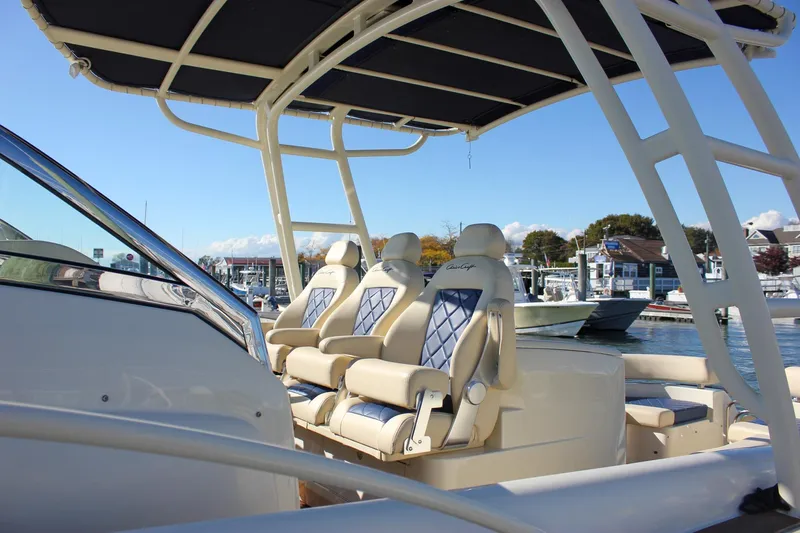 Phoenix Yacht Photos Pics 2017 Chris-Craft Launch 38 boat interior with luxury seating and canopy at marina.