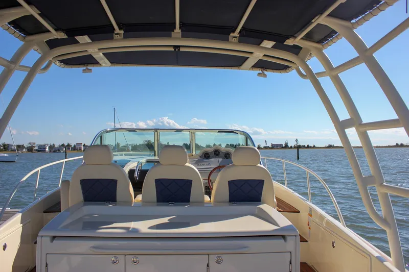 Phoenix Yacht Photos Pics 2017 Chris-Craft Launch 38 boat interior with seating, helm, and open water view.