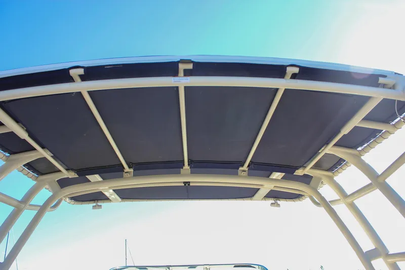 Phoenix Yacht Photos Pics 2017 Chris-Craft Launch 38 boat canopy under clear blue sky.