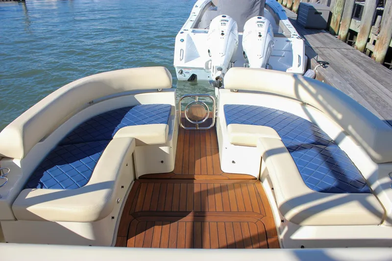 Phoenix Yacht Photos Pics 2017 Chris-Craft Launch 38 boat with elegant seating and twin engines at dock.