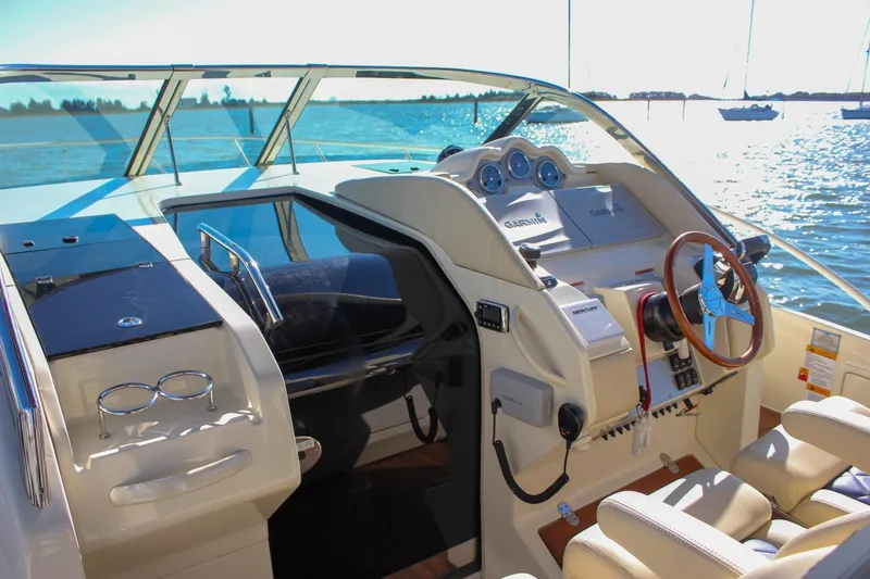 Phoenix Yacht Photos Pics 2017 Chris-Craft Launch 38 helm with modern controls and scenic water view.