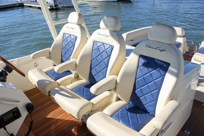 Phoenix Yacht Photos Pics Luxurious seating on 2017 Chris-Craft Launch 38 boat with blue and white upholstery.