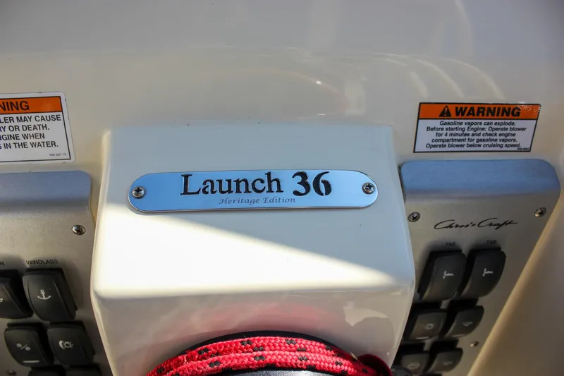 Phoenix Yacht Photos Pics Control panel of a 2017 Chris-Craft Launch 38 boat with warning labels.