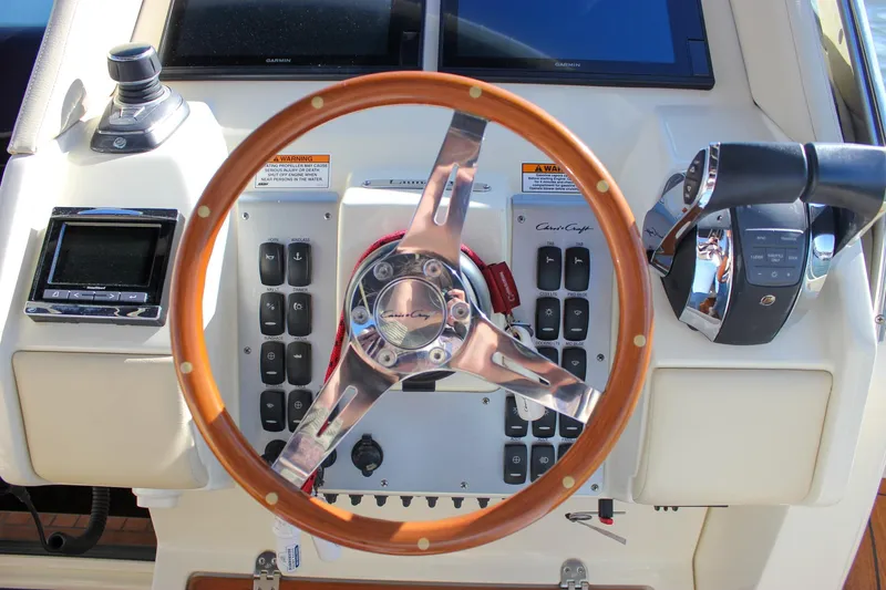 Phoenix Yacht Photos Pics Steering wheel and controls of 2017 Chris-Craft Launch 38 boat cockpit.