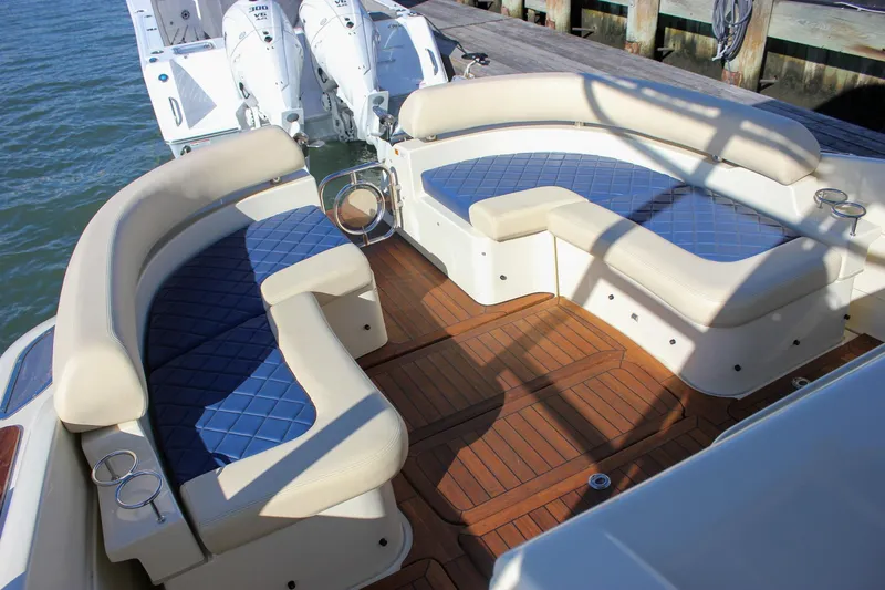 Phoenix Yacht Photos Pics 2017 Chris-Craft Launch 38 boat with elegant seating and teak flooring at a dock.