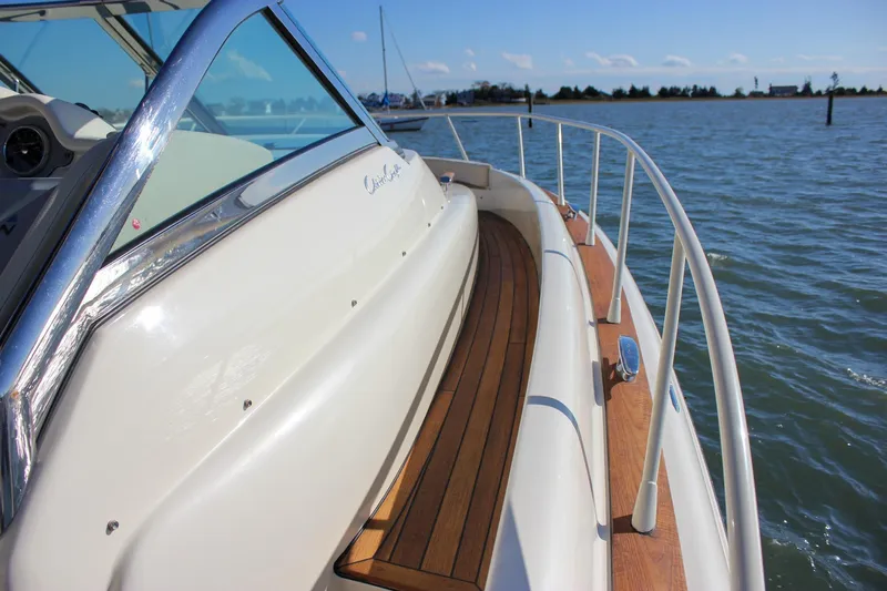 Phoenix Yacht Photos Pics 2017 Chris-Craft Launch 38 boat with wooden deck, cruising on a sunny day.