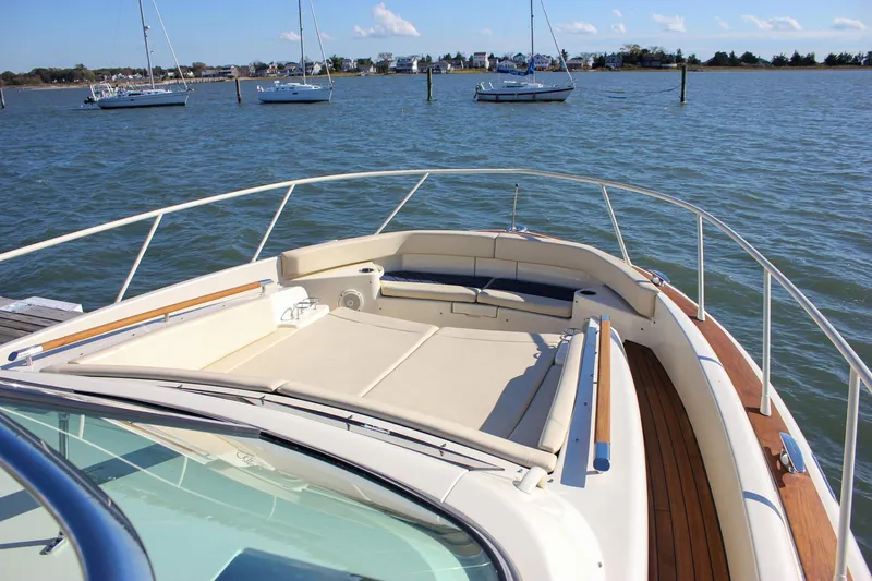 Phoenix Yacht Photos Pics 2017 Chris-Craft Launch 38 boat with spacious deck, docked in a serene marina.