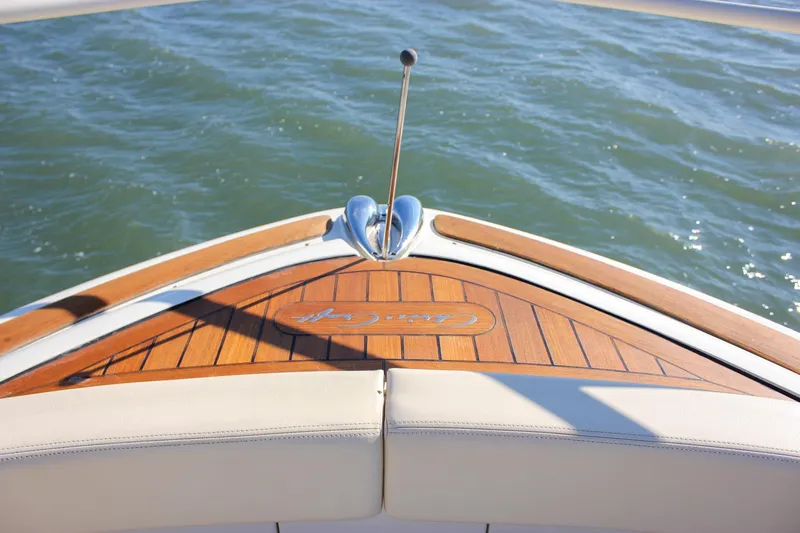 Phoenix Yacht Photos Pics 2017 Chris-Craft Launch 38 boat with teak deck, cruising on water.