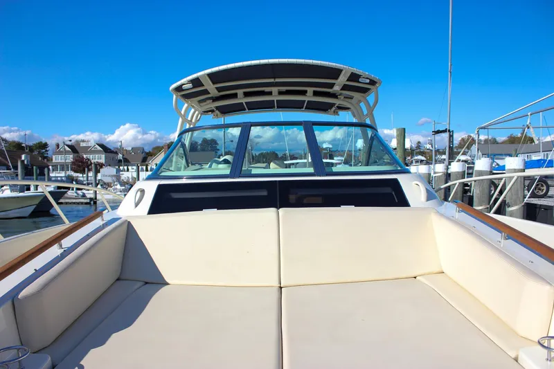 Phoenix Yacht Photos Pics 2017 Chris-Craft Launch 38 boat with spacious seating, docked at a marina under clear blue skies.
