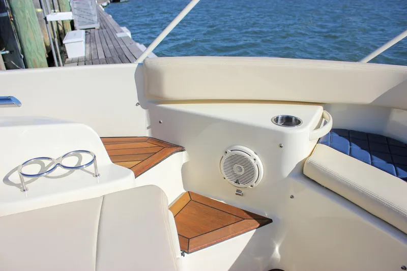 Phoenix Yacht Photos Pics 2017 Chris-Craft Launch 38 interior with teak accents and cup holders by the water.