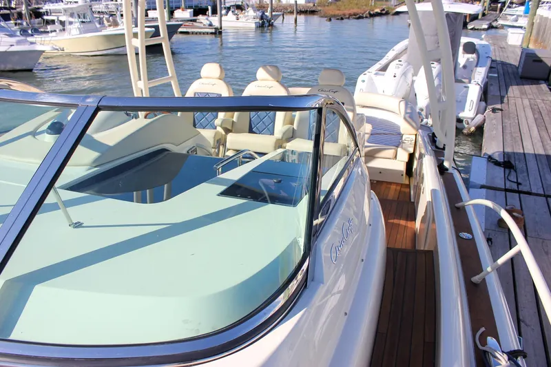 Phoenix Yacht Photos Pics 2017 Chris-Craft Launch 38 boat docked, featuring elegant seating and sleek design.