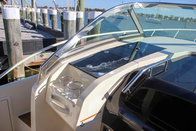 Phoenix Yacht Photos Pics 2017 Chris-Craft Launch 38 boat dashboard with cup holders and sleek design.