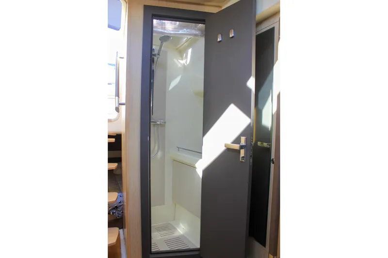 Phoenix Yacht Photos Pics 2017 Chris-Craft Launch 38 interior shower with modern design and sleek fixtures.