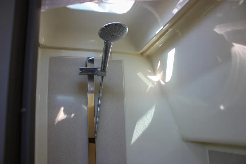 Phoenix Yacht Photos Pics Shower area inside 2017 Chris-Craft Launch 38 boat, featuring modern fixtures.