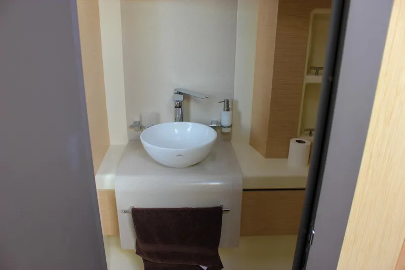 Phoenix Yacht Photos Pics Luxurious bathroom in 2017 Chris-Craft Launch 38 yacht with modern sink and fixtures.