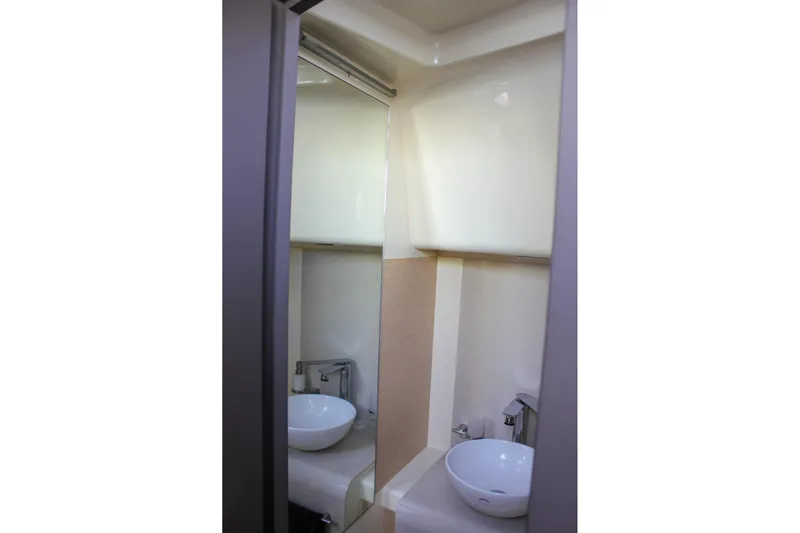 Phoenix Yacht Photos Pics 2017 Chris-Craft Launch 38 bathroom with modern sink and mirror.