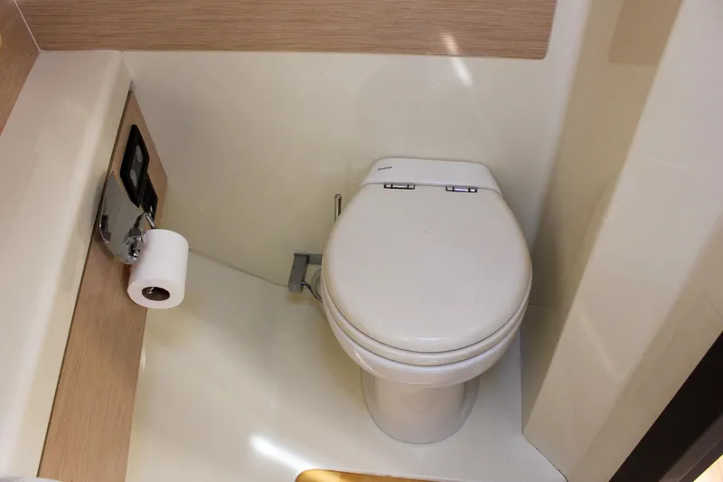 Phoenix Yacht Photos Pics 2017 Chris-Craft Launch 38 boat bathroom with modern toilet and paper holder.