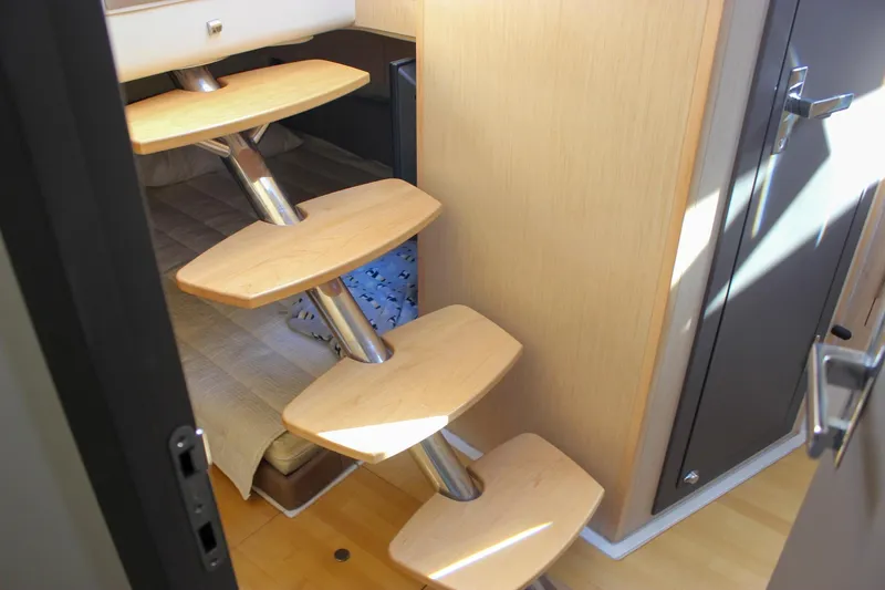 Phoenix Yacht Photos Pics 2017 Chris-Craft Launch 38 interior with modern wooden stairs and cozy cabin.