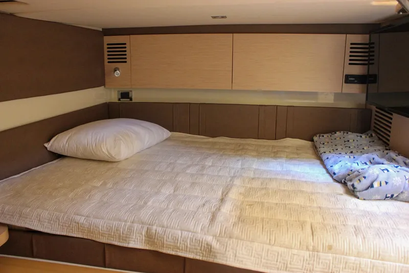 Phoenix Yacht Photos Pics 2017 Chris-Craft Launch 38 cabin interior with cozy bed and modern design.