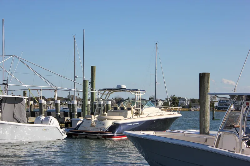 Phoenix Yacht Photos Pics 2017 Chris-Craft Launch 38 docked at a marina on a sunny day.