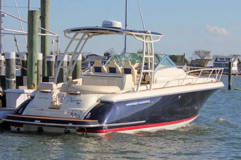 Phoenix Yacht Photos Pics 2017 Chris-Craft Launch 38 boat docked in a marina, featuring elegant design and luxury seating.