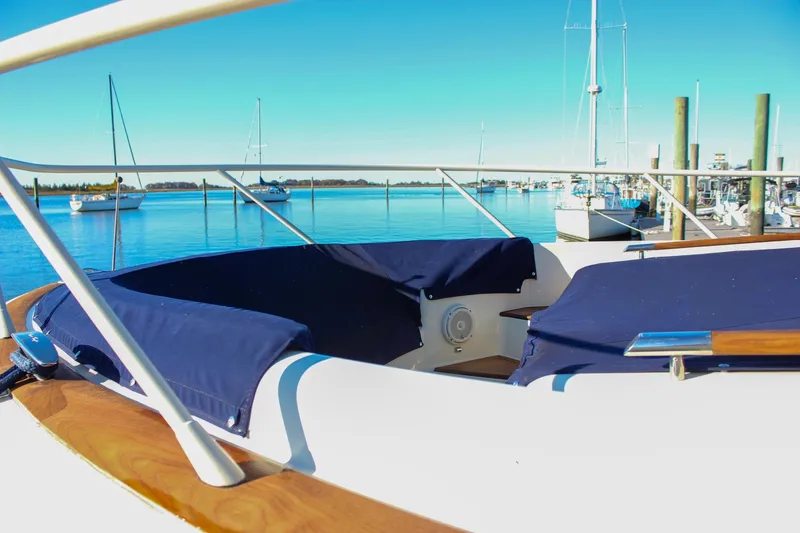 Phoenix Yacht Photos Pics 2017 Chris-Craft Launch 38 boat docked in a serene marina setting.