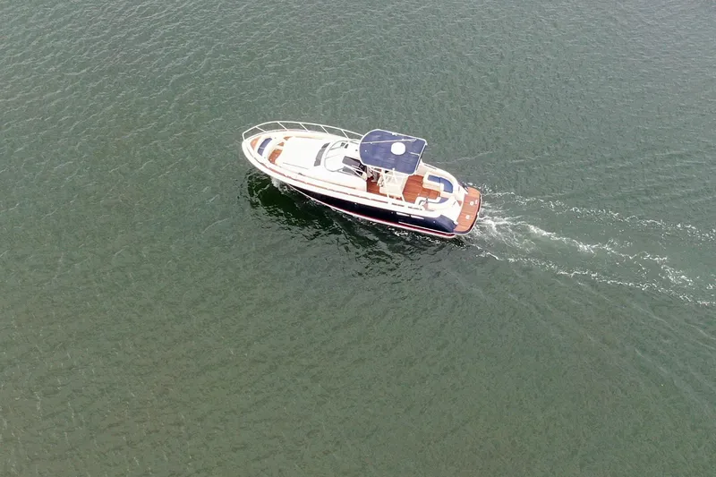 Phoenix Yacht Photos Pics 2017 Chris-Craft Launch 38 cruising on open water, aerial view.