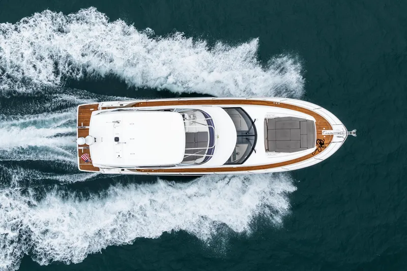 Seeworthy Yacht Photos Pics Aerial view of 2018 Prestige 560 yacht cruising on open water.