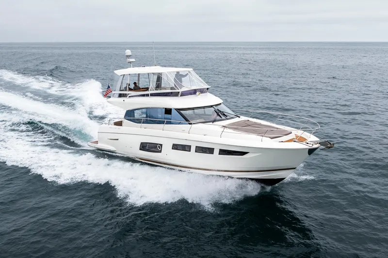 Seeworthy Yacht Photos Pics Luxurious 2018 Prestige 560 yacht cruising on open sea, showcasing sleek design and elegance.