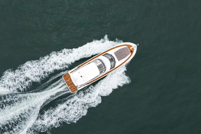 Seeworthy Yacht Photos Pics Aerial view of 2018 Prestige 560 yacht cruising on open water.