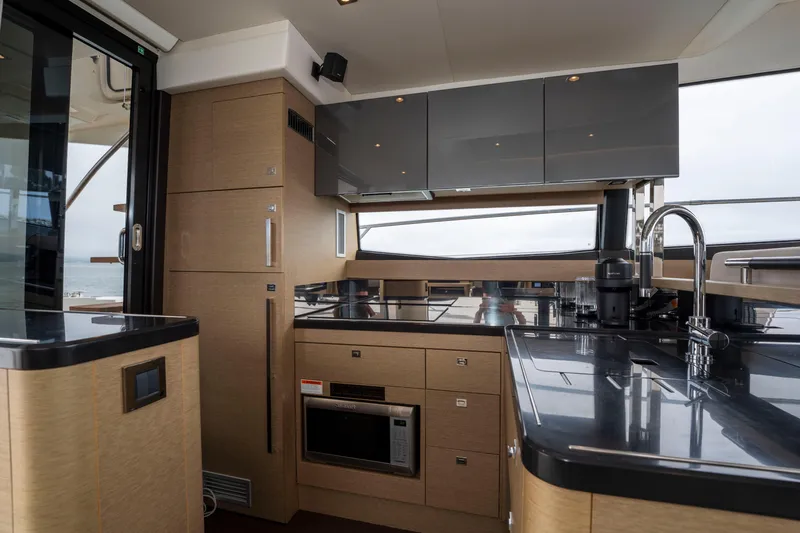 Seeworthy Yacht Photos Pics Luxurious kitchen interior of 2018 Prestige 560 yacht with modern appliances and sleek design.