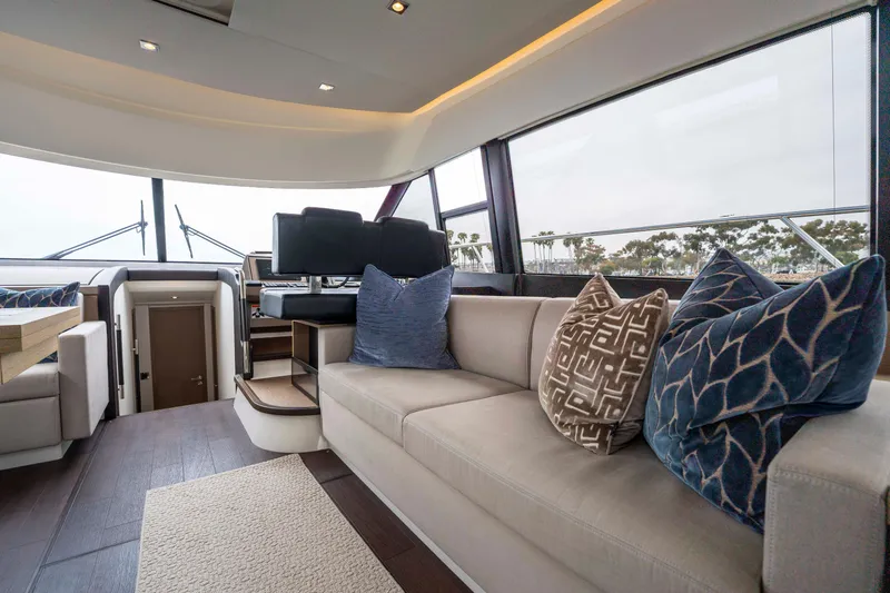 Seeworthy Yacht Photos Pics Luxurious interior of 2018 Prestige 560 yacht with plush seating and elegant decor.