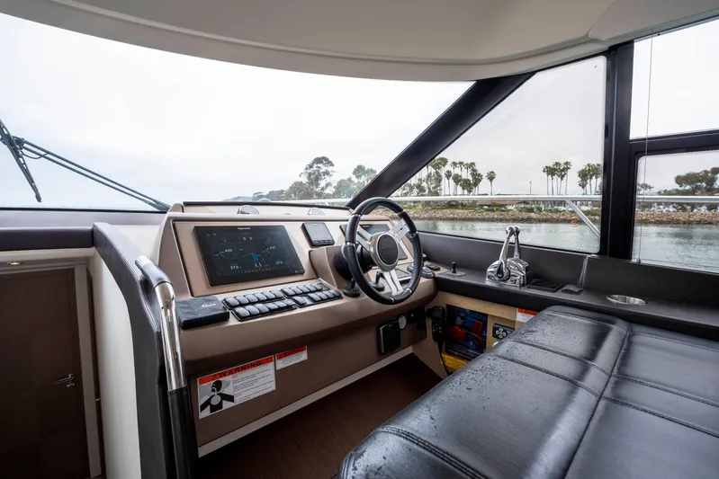 Seeworthy Yacht Photos Pics Helm of 2018 Prestige 560 yacht with modern controls and panoramic view.